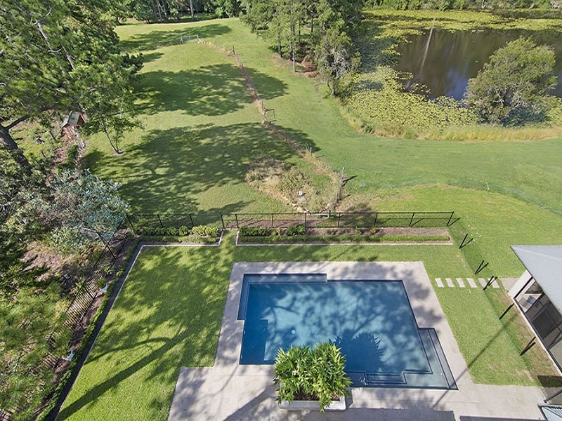 Aerial shot of concrete pool and landscape project